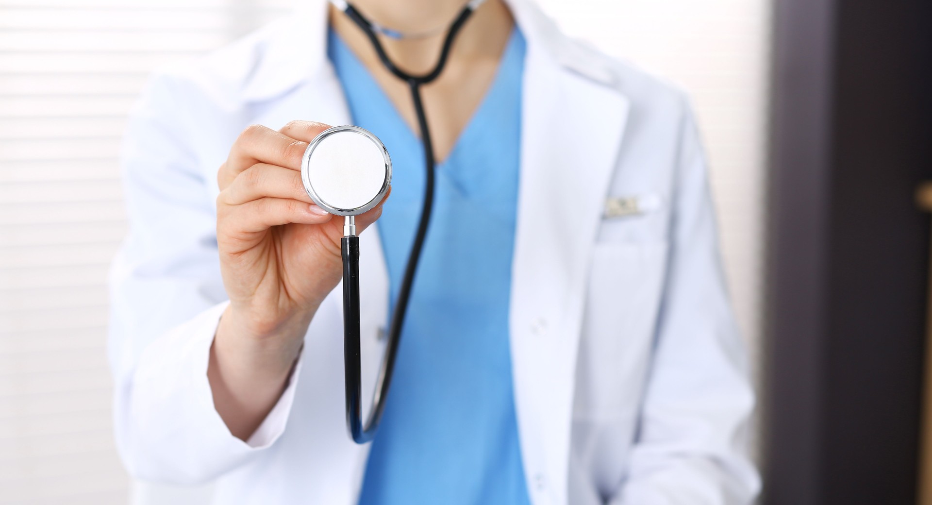 Unknown doctor woman holds stethoscope head, close-up. Physician ready to examine and help patient. Helping and insurance in health care, best treatment and medicine concept